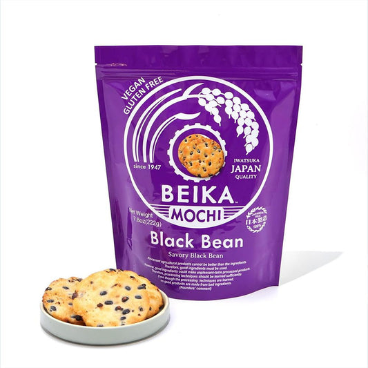 Japanese snack packaging detail: purple Beika Mochi stand up pouch with a press to close zipper below the top seal, and black bean rice crackers on a small plate