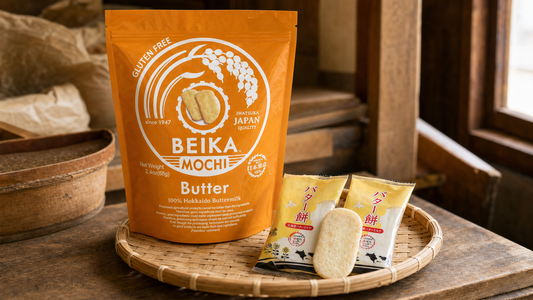 Beika Mochi Butter pouch with individually wrapped butter mochi senbei on a bamboo tray